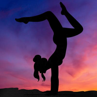 a woman doing a handstand