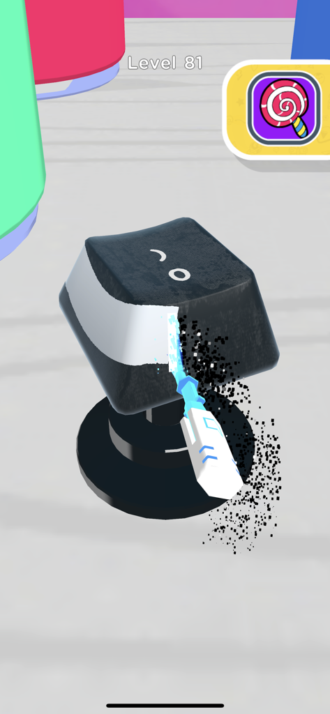 Spray painting a white design onto a black keyboard keycap in a mobile game