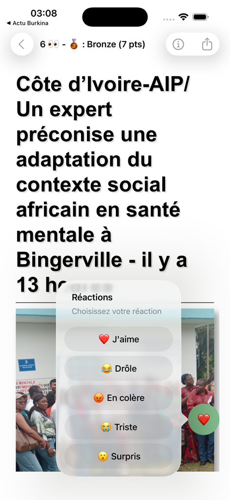 Un articolo di notizie sull'app Actu Côte d'Ivoire con un menu di reazioni che mostra opzioni emoji