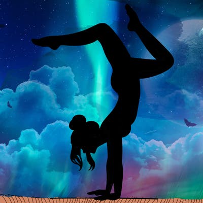 a woman doing a handstand