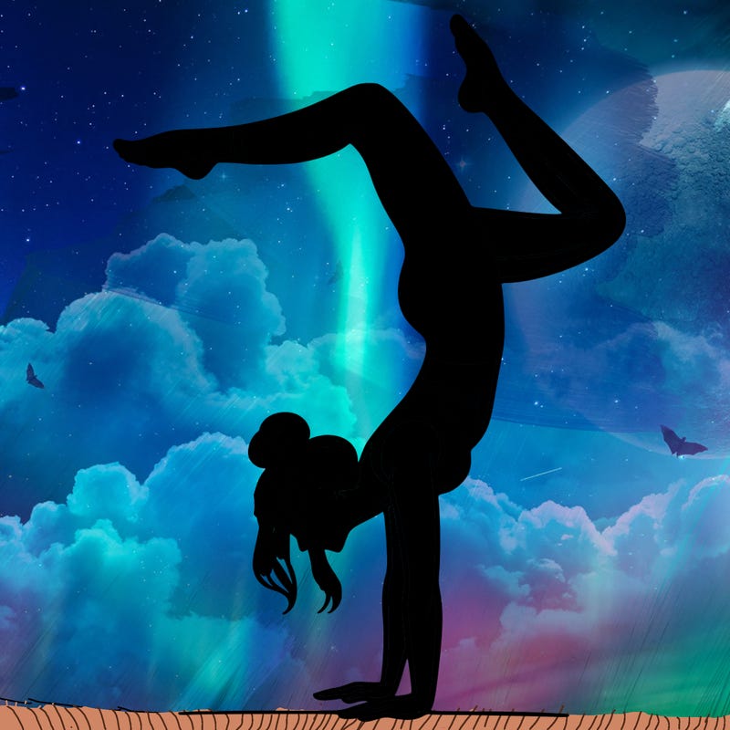 a woman doing a handstand