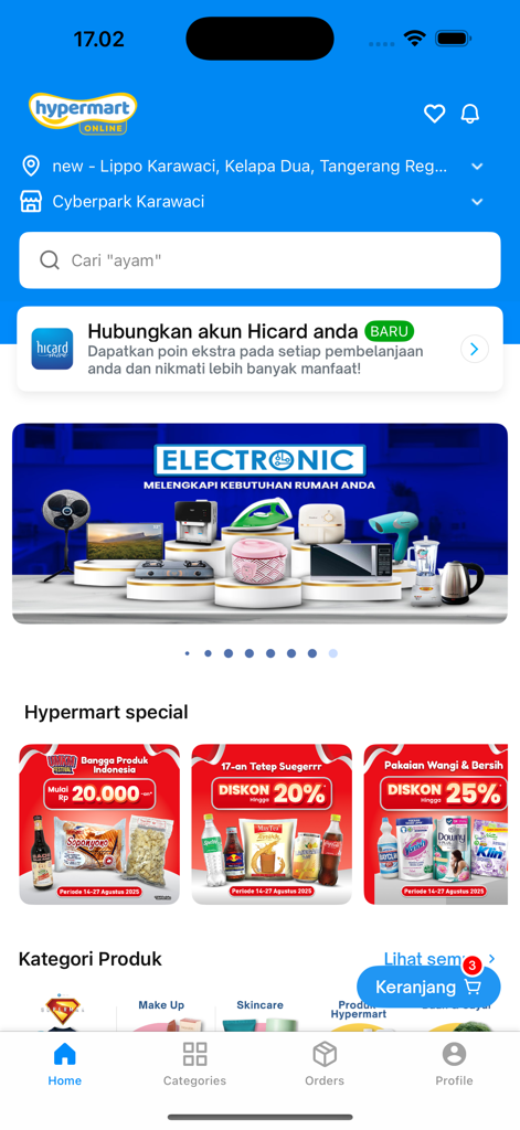 Hypermart mobile app home screen showing promotional banners for electronics and grocery items with a search bar and product categories.