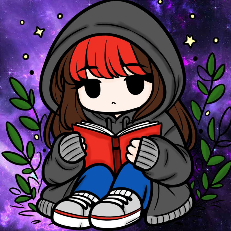 girl in oversized hoodie reading a book