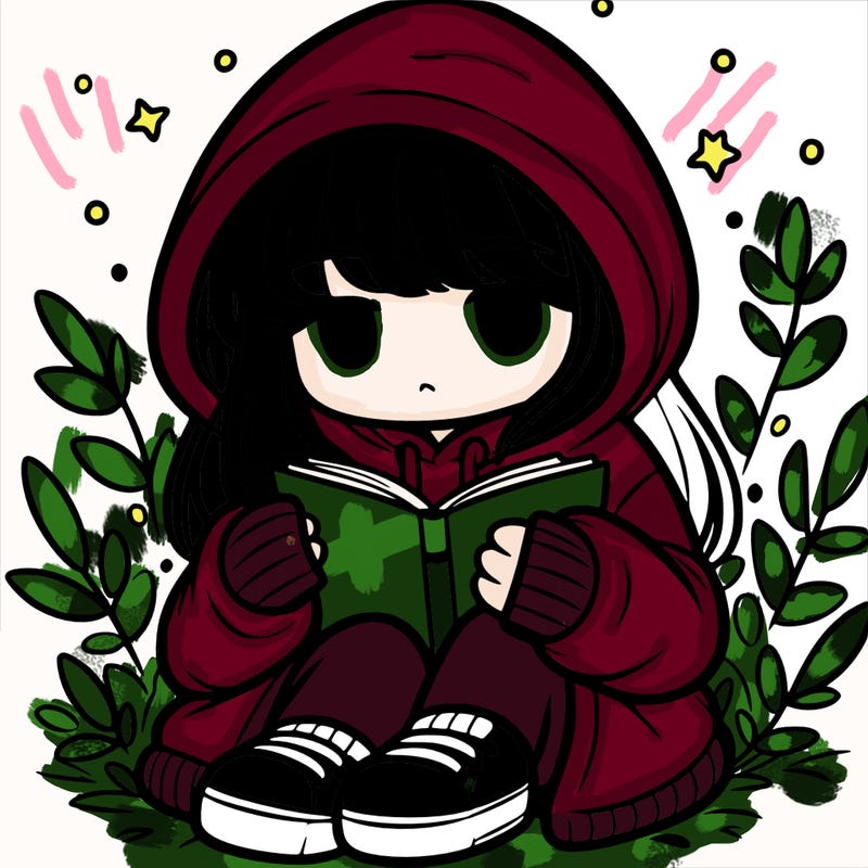 girl in oversized hoodie reading a book