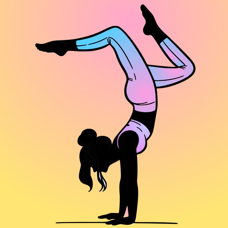 a woman doing a handstand