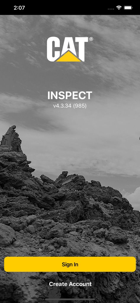 Cat® Inspect - Cat Inspect mobile app login screen featuring the Caterpillar logo and a yellow sign in button over a construction site background