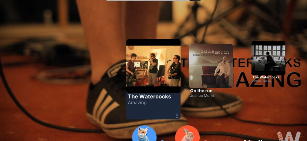SingFever - Your Sing Game - SingFever app interface showing a selection of karaoke songs with album covers and artist names