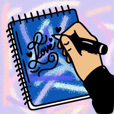 a hand writing “love” in calligraphy on a notebook