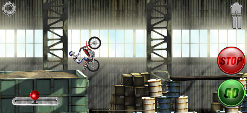 A motocross rider performing a stunt over barrels in the industrial zone of Bike Mania 2.