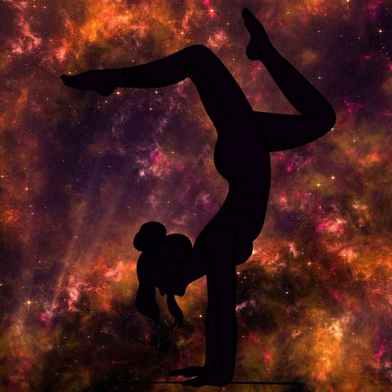 a woman doing a handstand