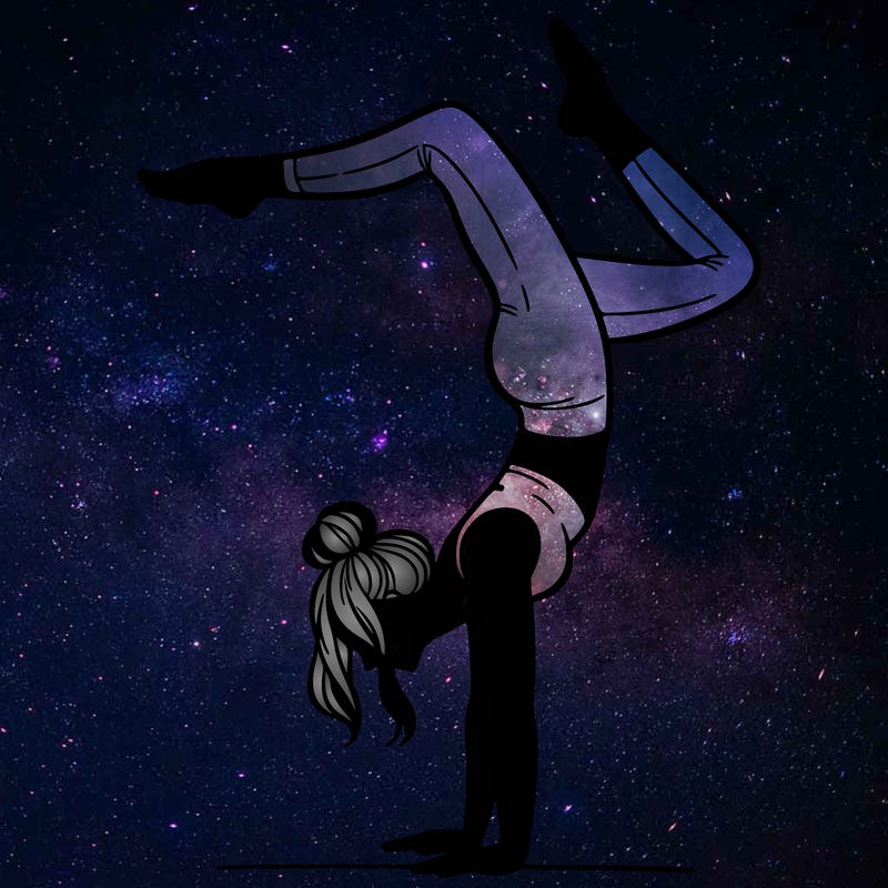 a woman doing a handstand