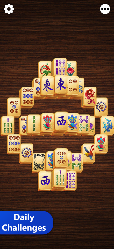 Mahjong Titan - Mahjong Titan game board with classic tiles and a daily challenges banner on a wooden background.