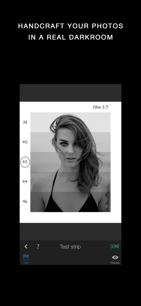 Darkr app interface displaying a black and white portrait with analog darkroom test strips for manual exposure adjustment.
