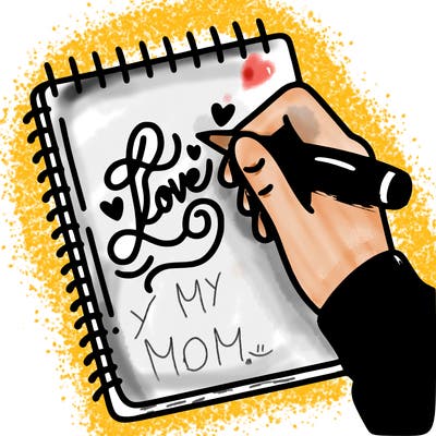 a hand writing “love” in calligraphy on a notebook