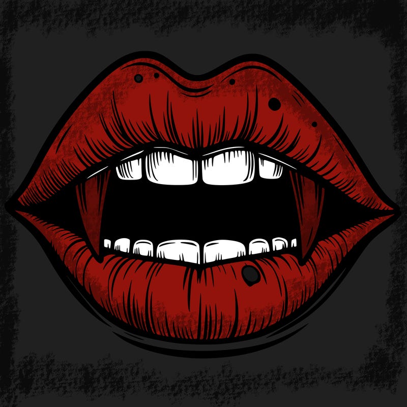 lips with vampire teeth