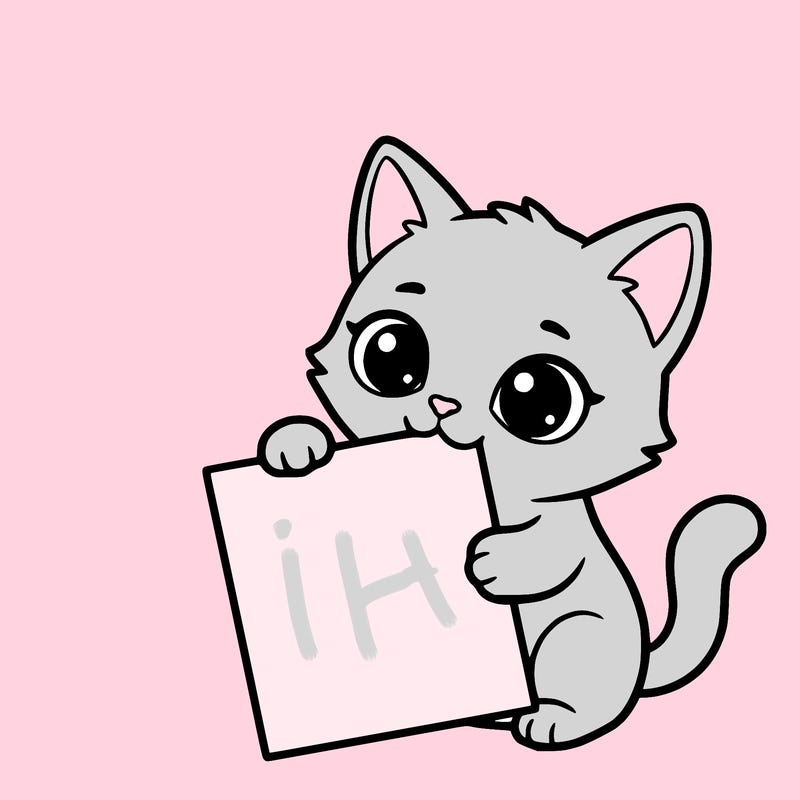 a small cat with a blank sheet of paper in its hand. the cat is sooooooo cute!