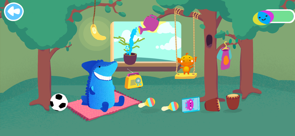 Moka Mera Lingua - Atlas the shark and Moka Mera the monster in an outdoor playroom with a radio and maracas