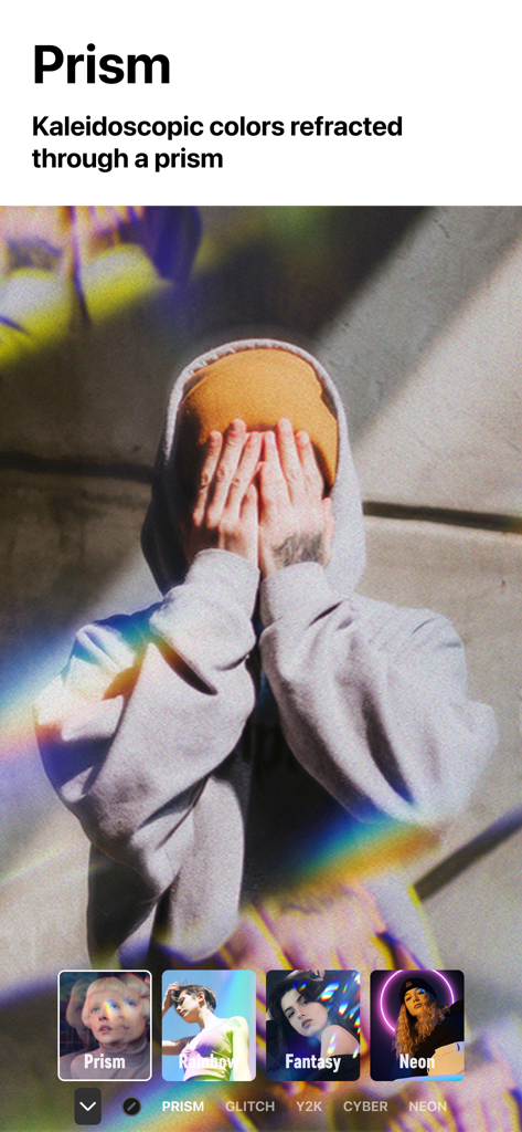 A photo of a person in a grey hoodie with a kaleidoscopic prism rainbow light effect applied via the Filto app.