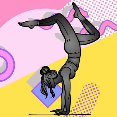 a woman doing a handstand