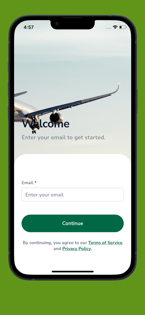 Écran d'accueil de l'application Key Travel Mobile avec un champ de saisie d'e-mail et un fond d'aile d'avion