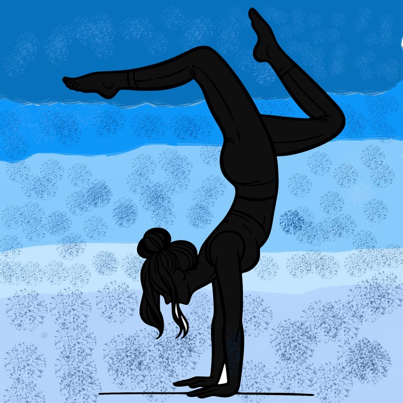 a woman doing a handstand