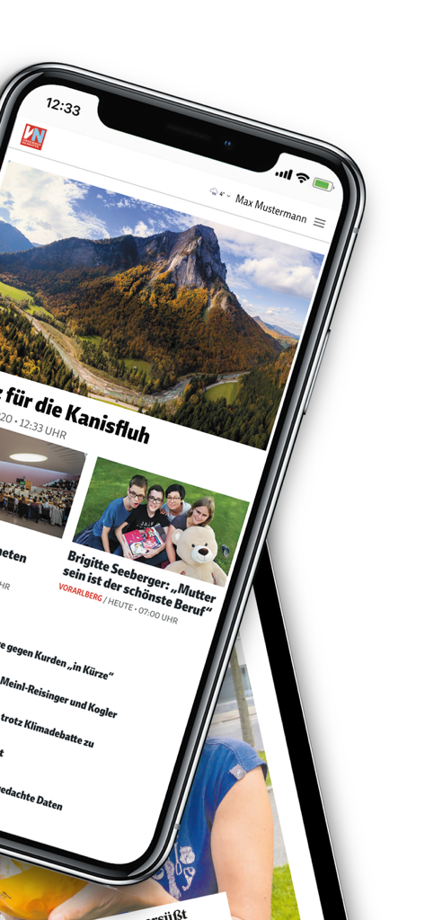 Smartphone displaying the Vorarlberger Nachrichten news app interface with local news headlines and landscape imagery