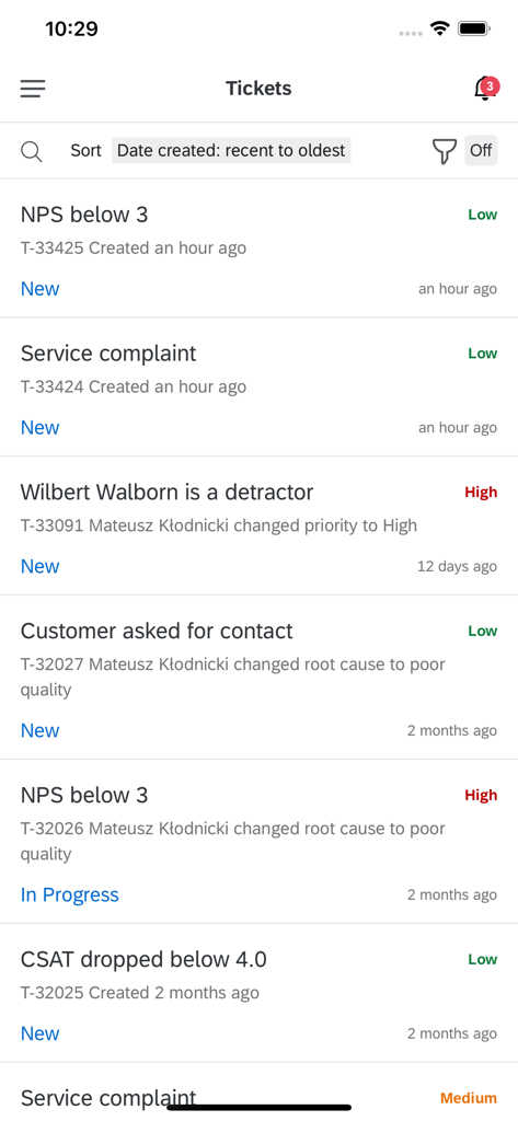 Qualtrics XM app tickets screen displaying customer experience alerts and status