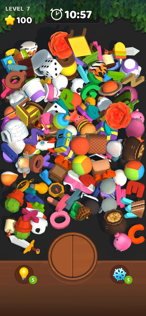 A cluttered pile of various 3D objects including animals letters and food items in the Match 3D Blast mobile game