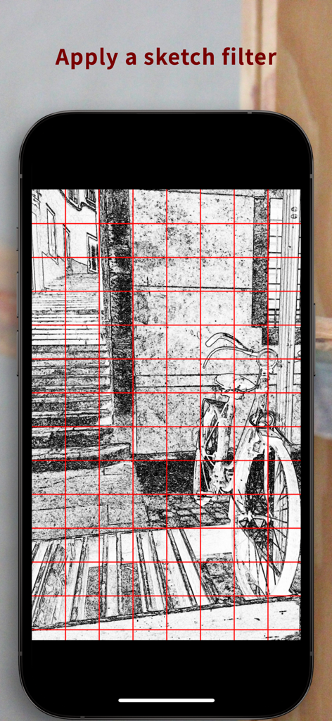 A black and white sketch filtered photo of a bicycle with a red grid overlay in the Sketch Grid app