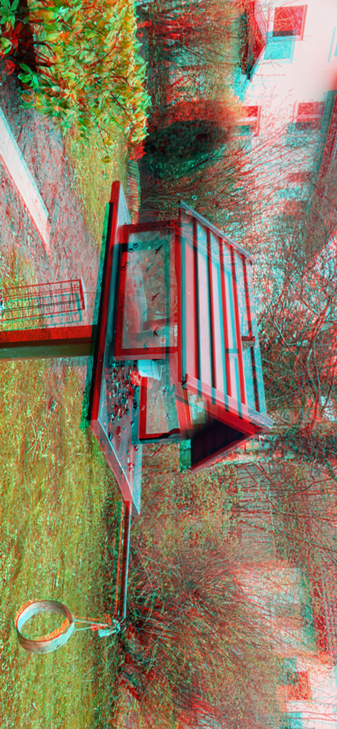 3D Camera One Shot - Red and cyan 3D anaglyph image of a wooden birdhouse in a garden