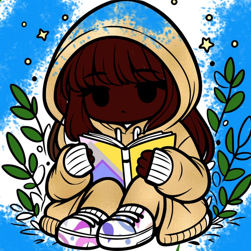 girl in oversized hoodie reading a book