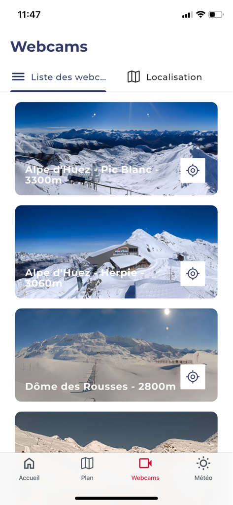 Interface of the Alpe d'Huez app displaying live webcam views of snowy mountain peaks including Pic Blanc and Dome des Rousses.