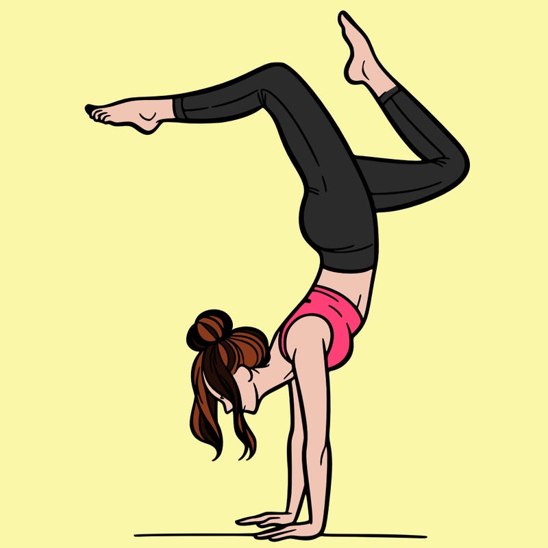 a woman doing a handstand
