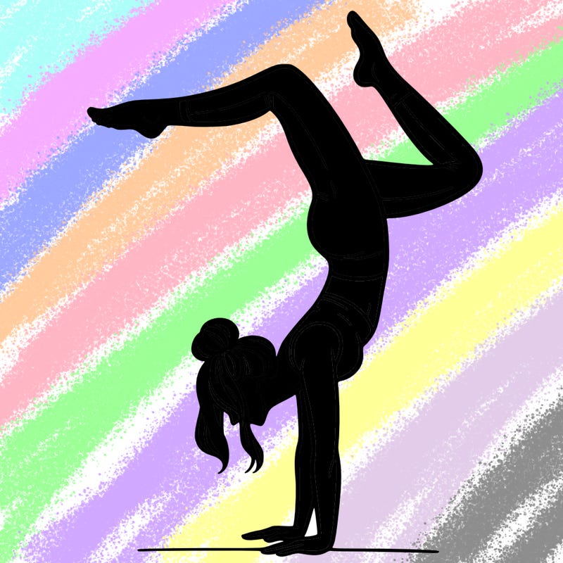 a woman doing a handstand