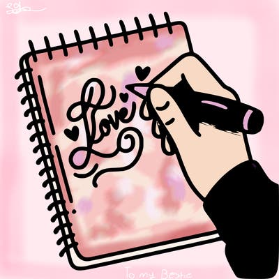 a hand writing “love” in calligraphy on a notebook