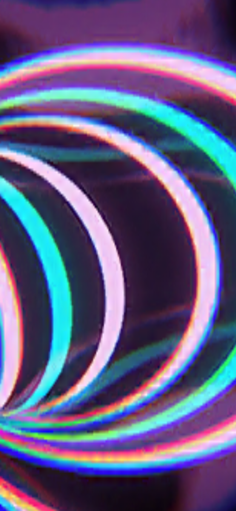 Colorful glowing neon rings creating a vibrant laser light show effect