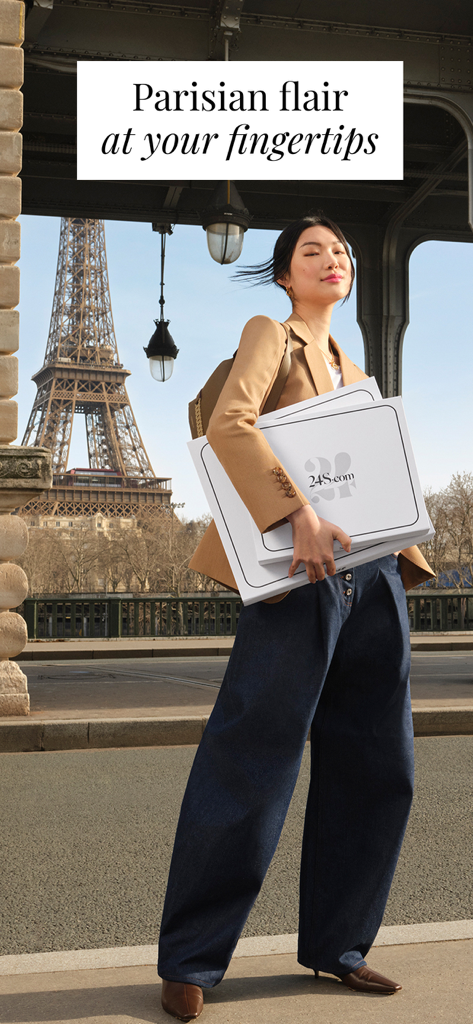 24S: Luxury Fashion Designers - Fashionable woman holding 24S luxury shopping boxes with the Eiffel Tower in the background