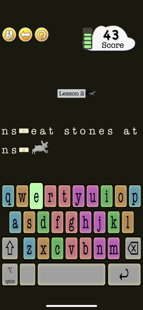 A touch typing lesson in Animal Typing Lite featuring a rabbit character and a colorful keyboard