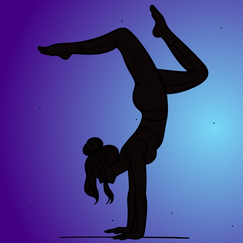 a woman doing a handstand
