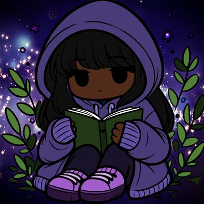 girl in oversized hoodie reading a book