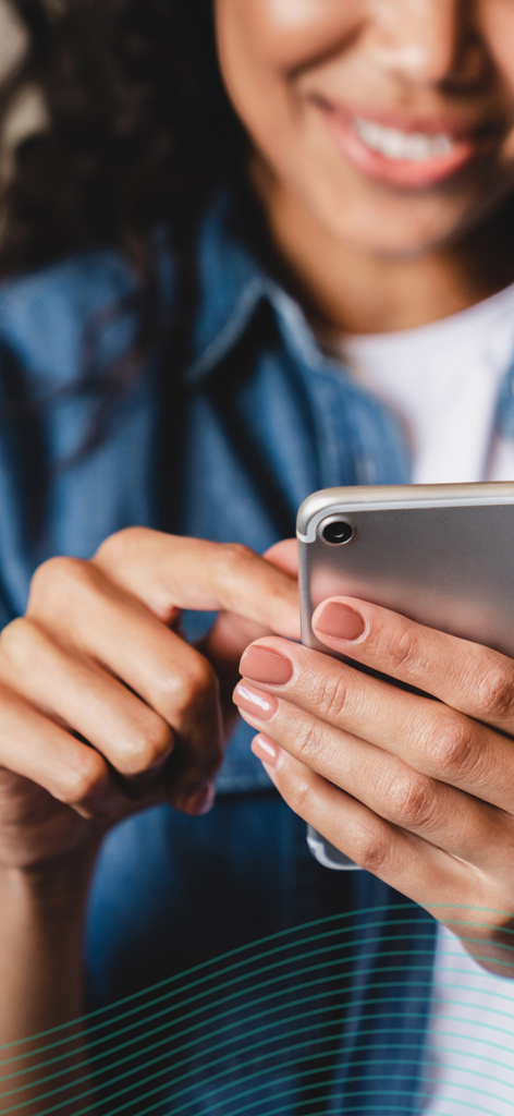 Echo Prayer - A woman smiling while using her smartphone for prayer reminders and organization