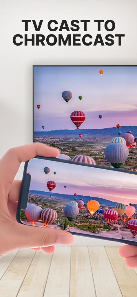 Uma tela de iPhone compartilhando uma foto de balões de ar quente para uma televisão grande usando o recurso de transmissão