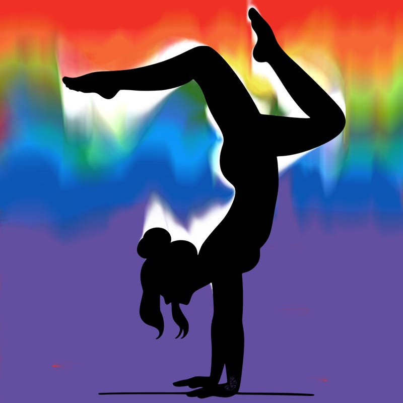 a woman doing a handstand