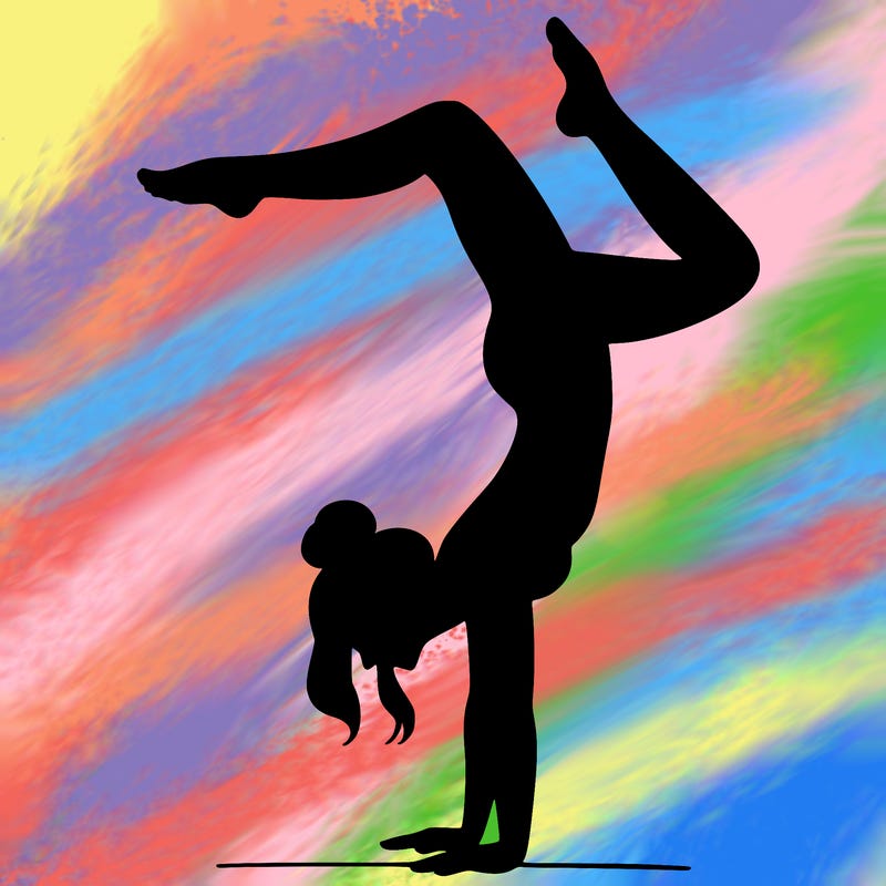 a woman doing a handstand