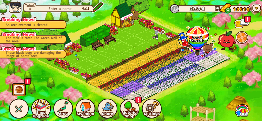 Gameplay screen of Hako My Mall showing a colorful flower garden and a circus hot air balloon.