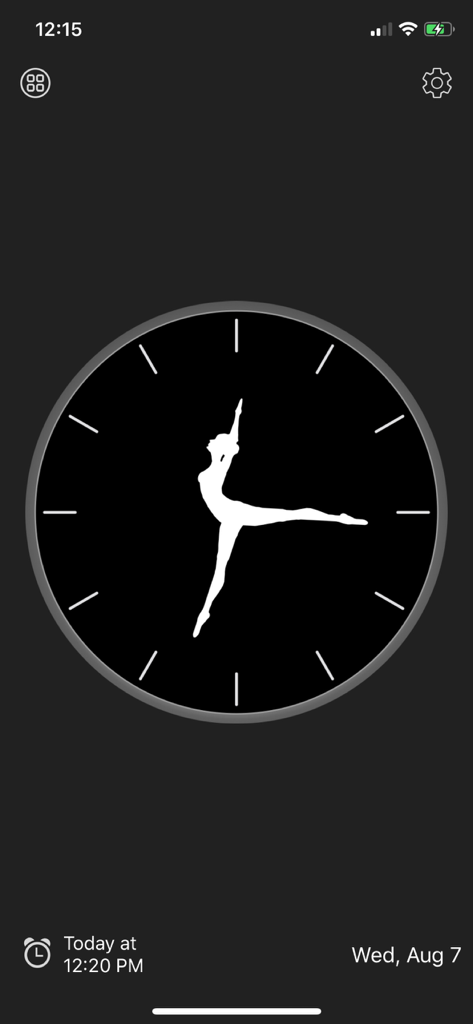 Reloj analógico estético con una silueta de bailarina como manecillas sobre un fondo oscuro