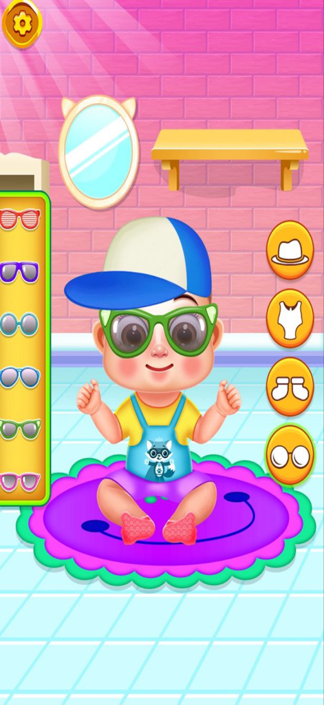 Cute Baby Sitter Daycare Games - A cartoon baby wearing a blue cap and green glasses in a dress up screen from the Cute Baby Sitter Daycare game.