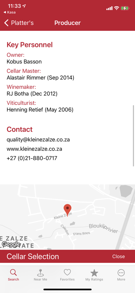 A mobile screen from the Platters Wine Guide app showing detailed wine producer information including key personnel contact details and a map location for the Kleine Zalze winery.