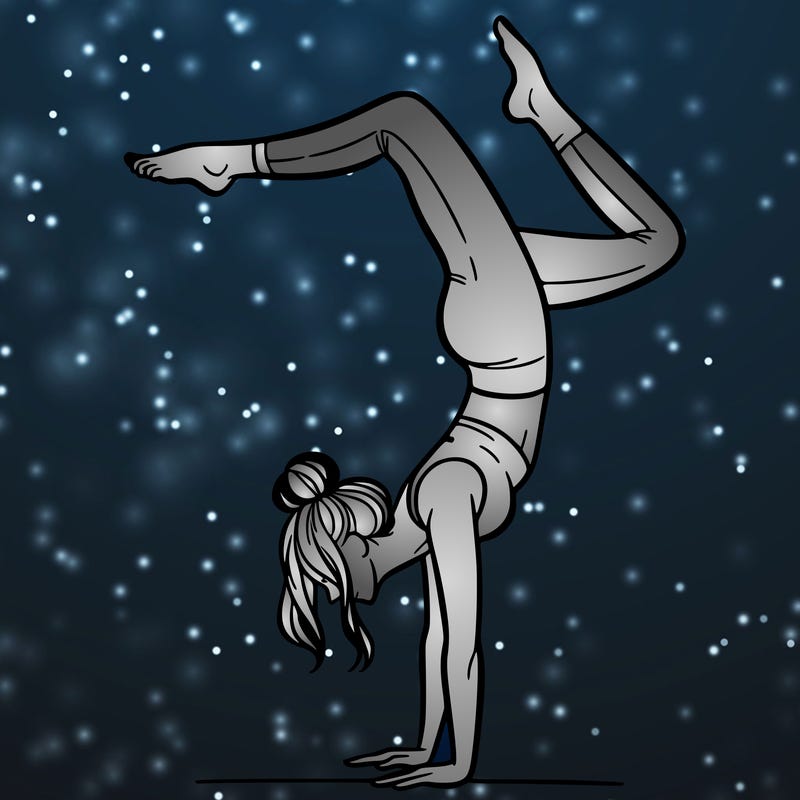 a woman doing a handstand