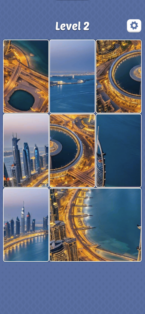 Mobile jigsaw puzzle interface showing a 3x3 grid of a city landscape at night labeled Level 2.